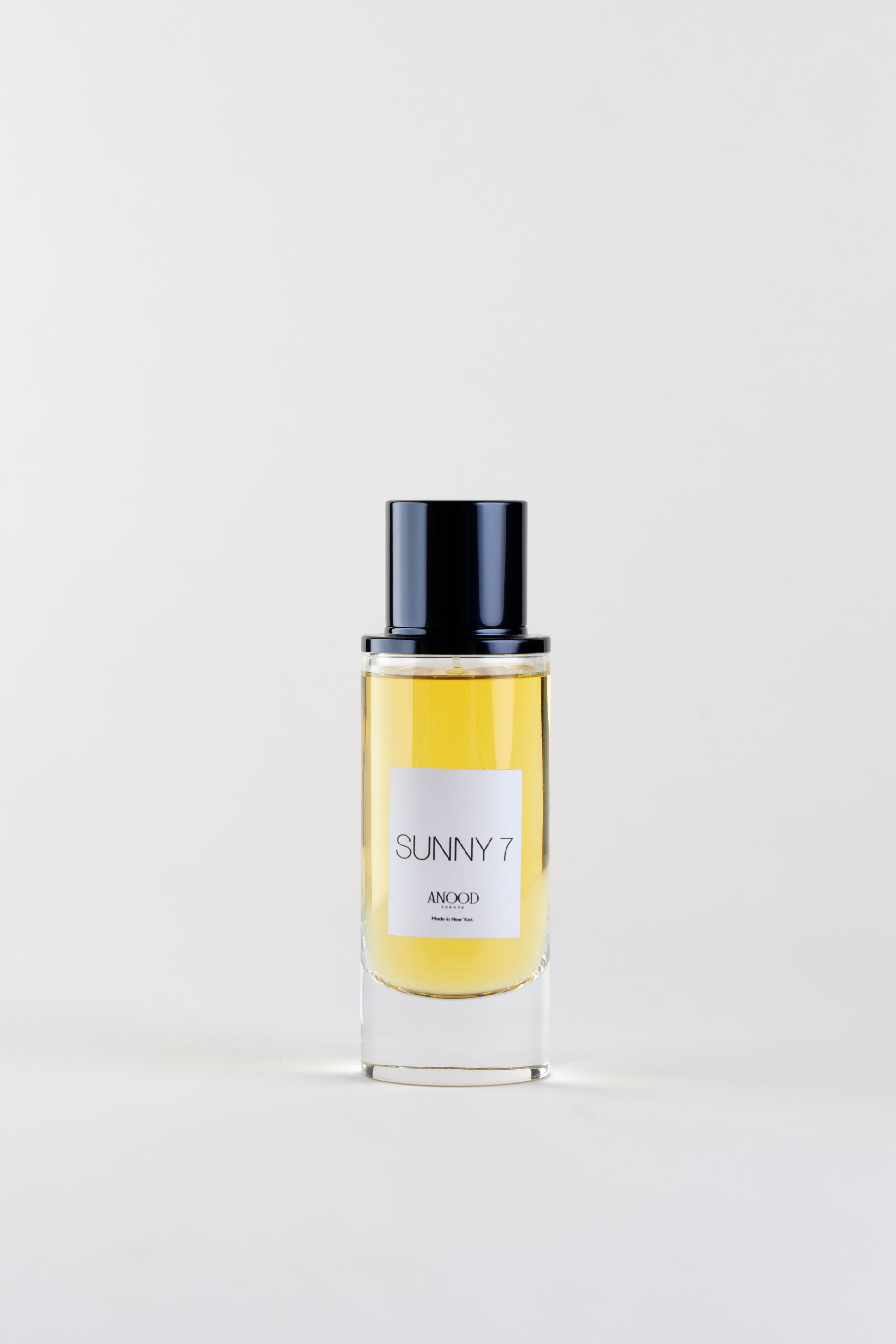 Perfume bottle labeled 'Sunny 7' on a white background